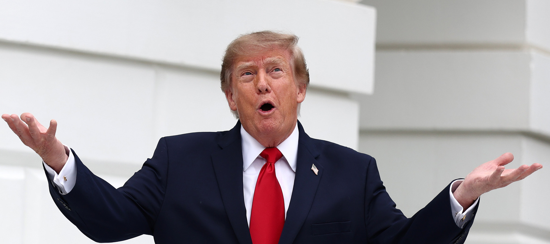 U.S. President Donald Trump greets attendees before a ribbon-cutting ceremony for the new helipad at the White House on September 21, 2026.