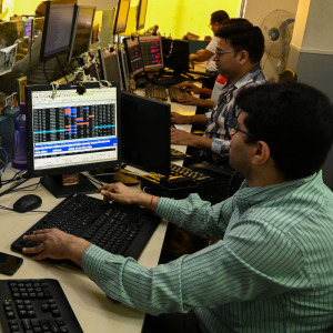Employee watching the markets.