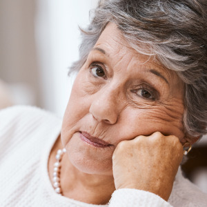 Woman is upset on the couch