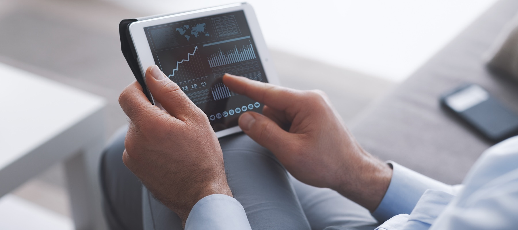 Person analyzing the stock market.