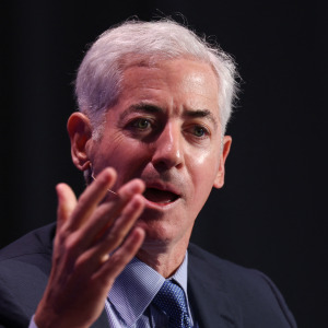 Bill Ackman holds his hand out in frustration.
