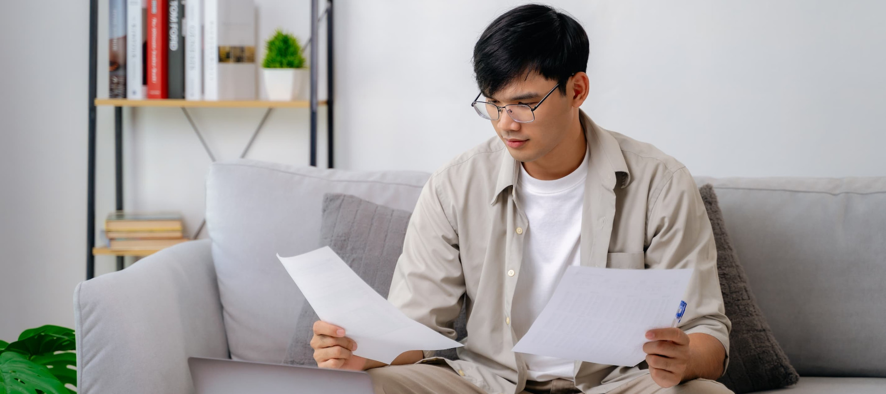 A photo of a man reviewing paperwork