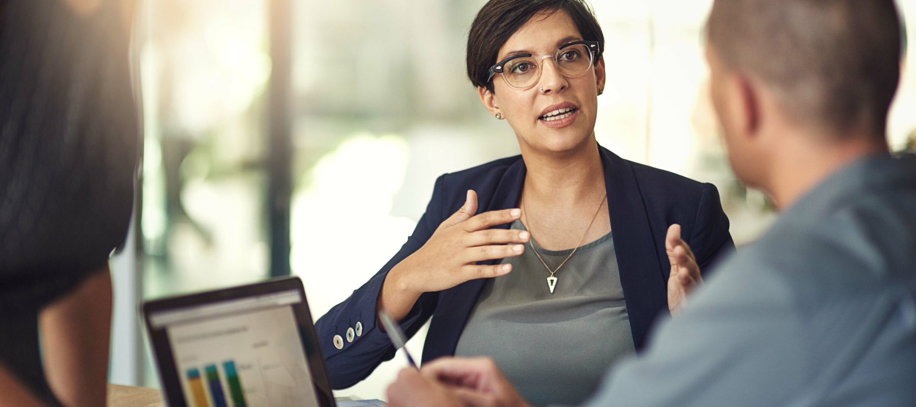 A photo of a financial expert explaining a concept to a client
