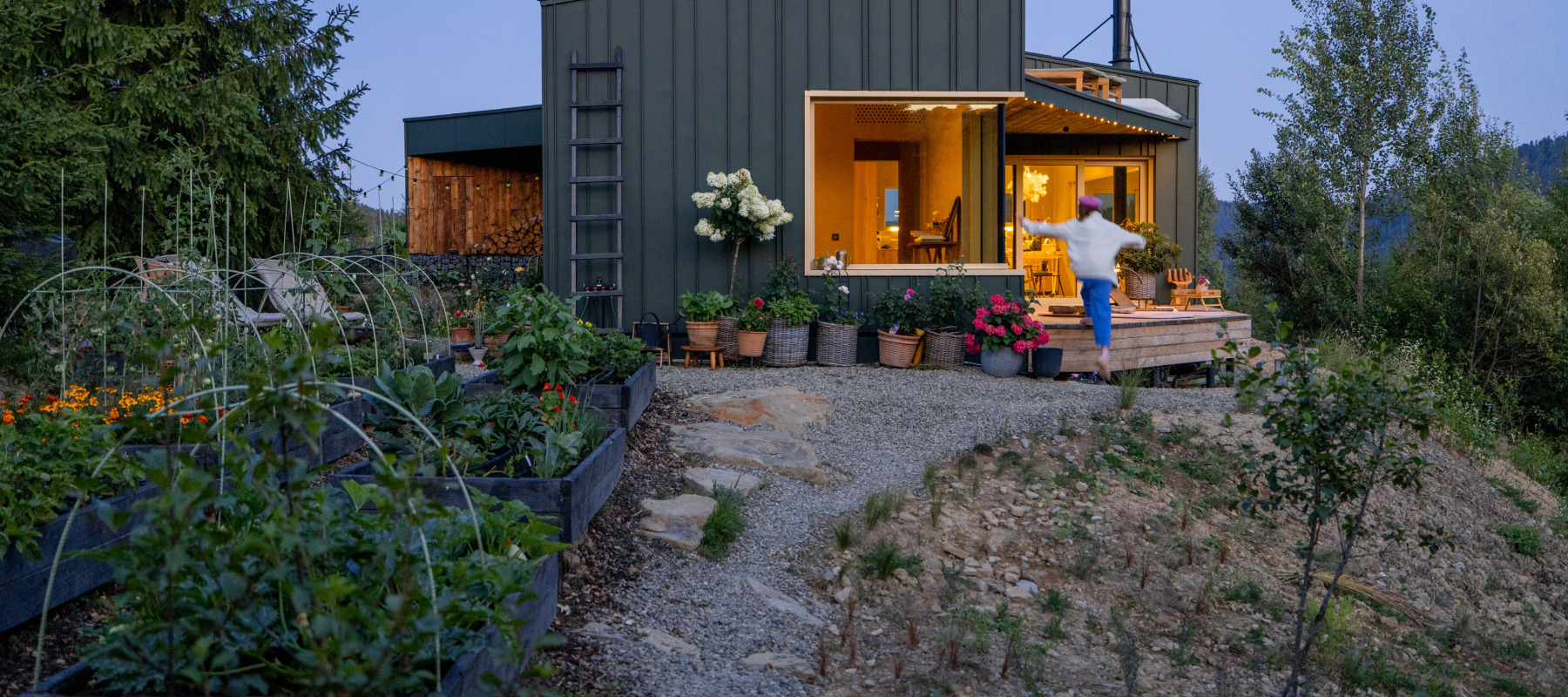 Woman outside of a tiny home