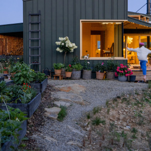 Woman outside of a tiny home