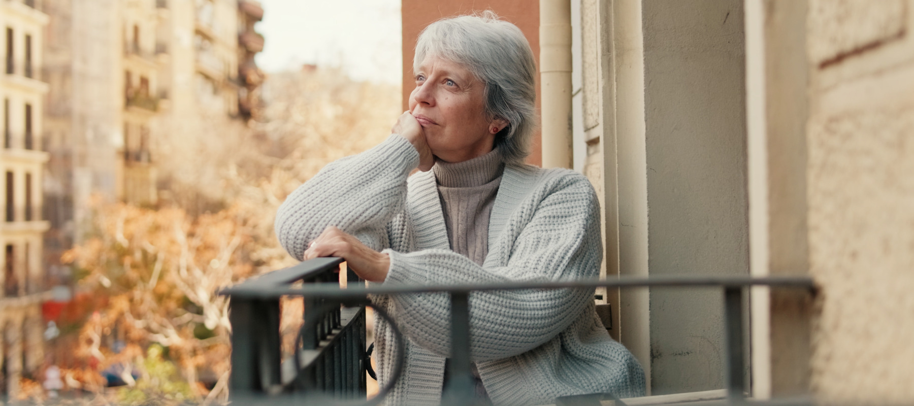 older woman on balcony