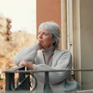older woman on balcony