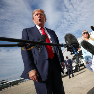 President Trump speaks with reporters before boarding Air Force One.