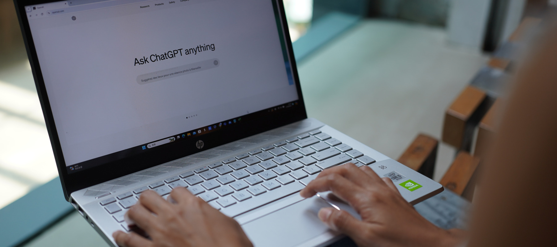 A woman using ChatGPT on her laptop.