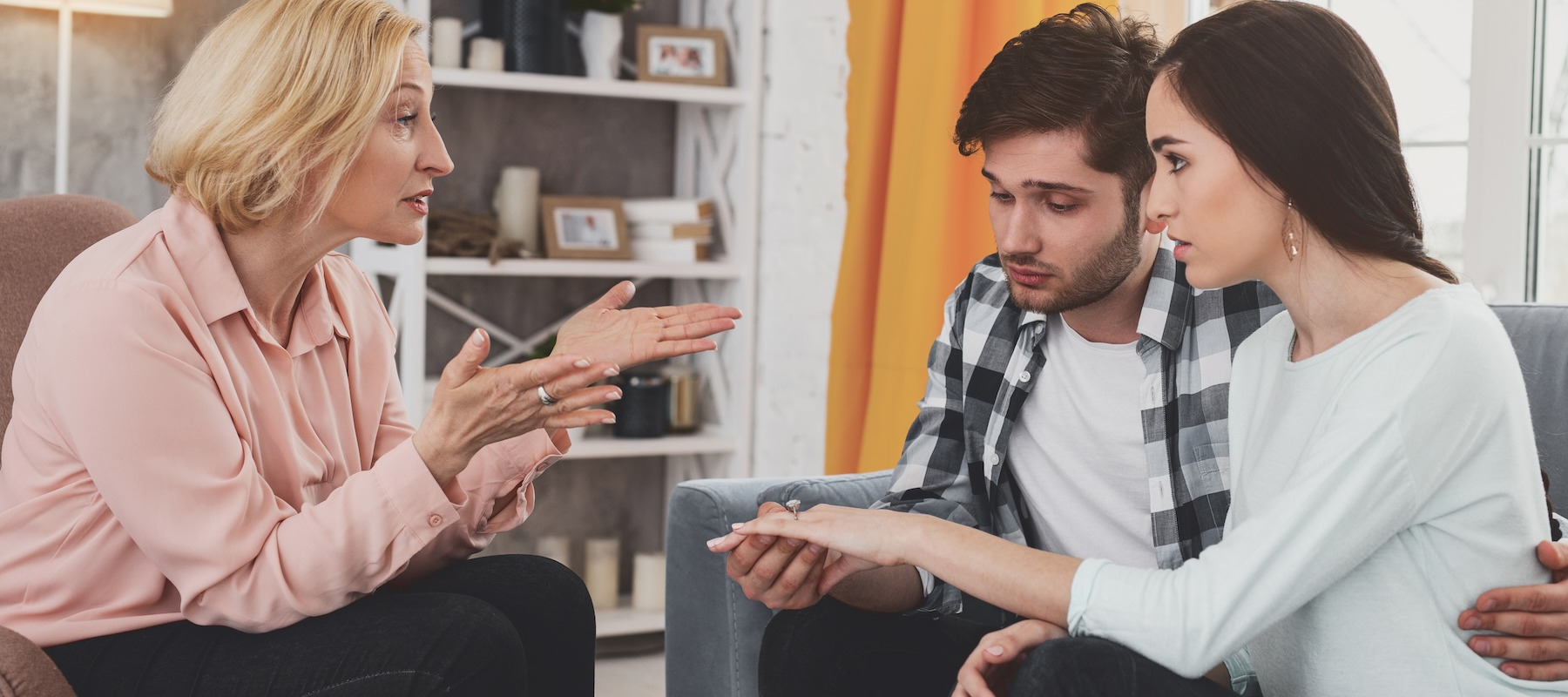 Stressed aunt talking to couple.