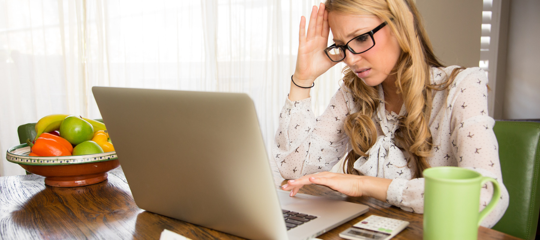 A woman gets frustrated while doing her taxes.