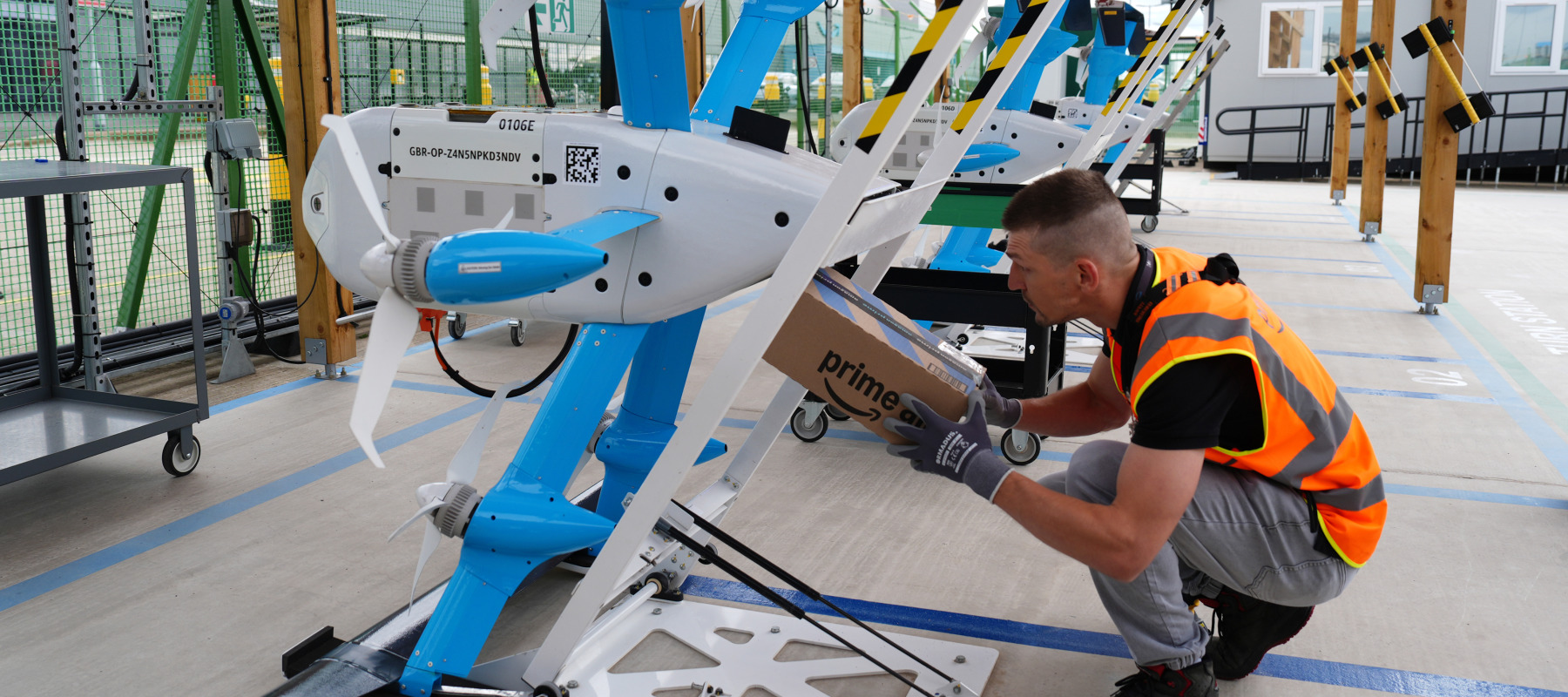 A delivery is staged for the media during trials of the Amazon drone delivery service.