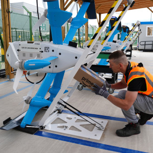 A delivery is staged for the media during trials of the Amazon drone delivery service.