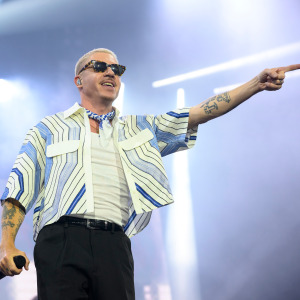 Macklemore performs live on stage.