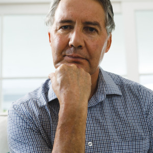 A man thinking in his living room