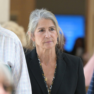 Former Colorado Bureau of Investigation forensic scientist Yvonne "Missy" Woods, center, leaves at Jefferson County District Court in June.