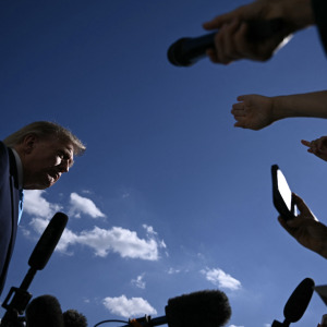 President Donald Trump talks to the media before boarding Marine One as he departs from the South Lawn of the White House in Washington.
