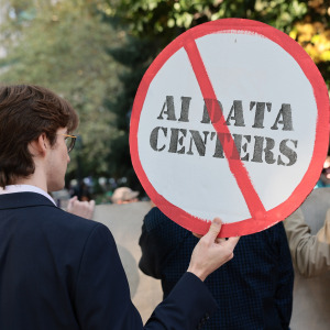 Person holding an anti-AI protest sign