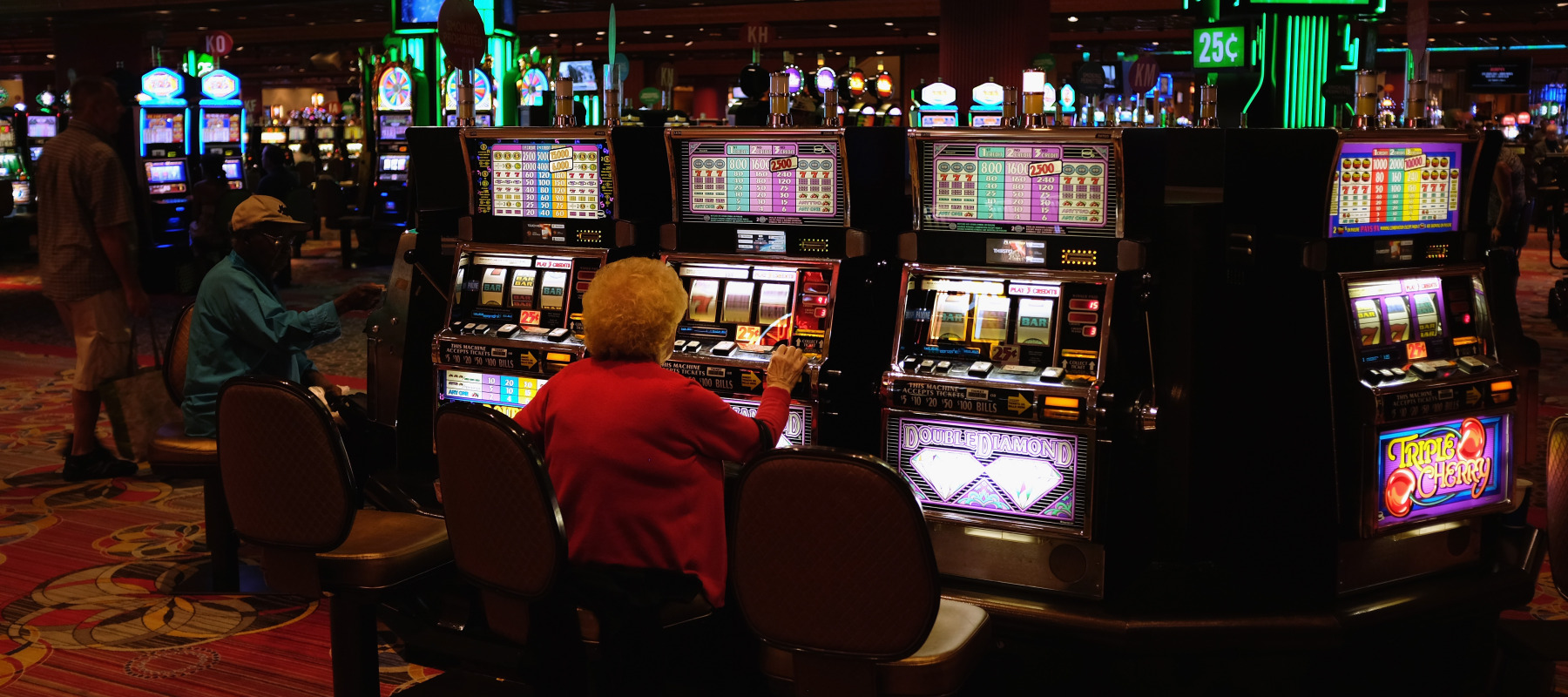 An elderly woman plays slot machines in a casino on the Atlantic City Boardwalk on in New Jersey.