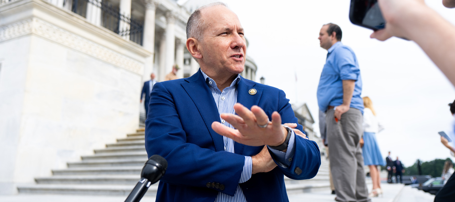 Rep. Lloyd Smucker, R-Pa., speaks to reporters on the House steps.