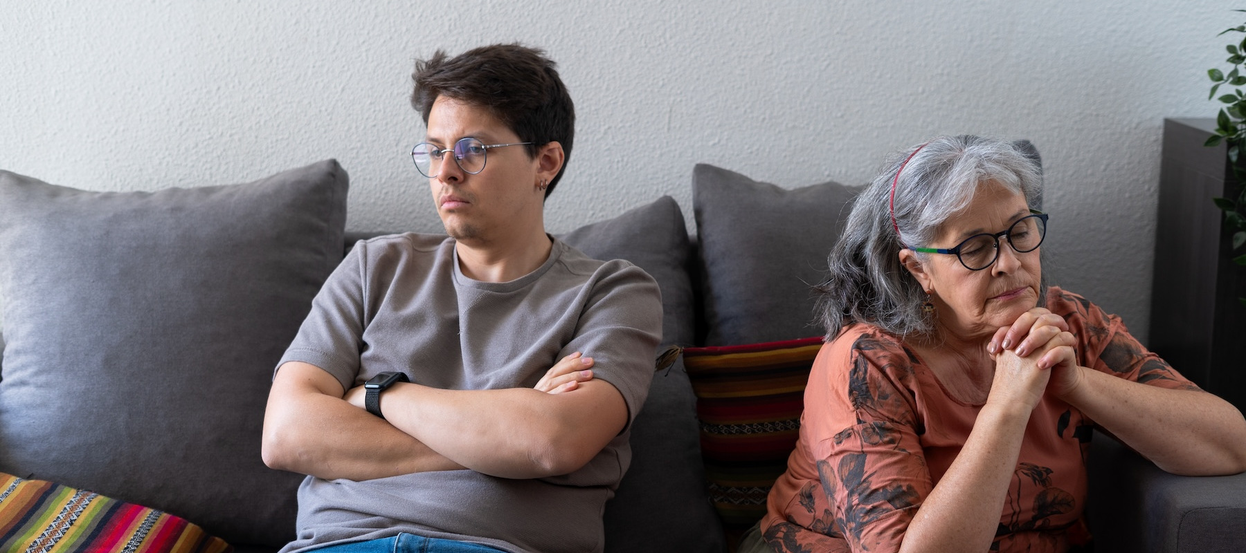 Mother and son upset on the couch.