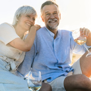 Photo of happy older couple on beach