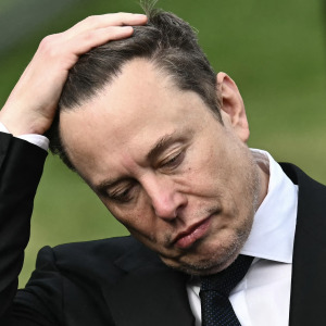 CEO of Tesla and SpaceX Elon Musk reacts as US President Donald Trump speaks to the press after a meeting with technology executives about artificial intelligence at the White House.