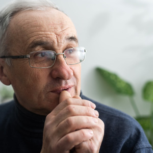 Thoughtful 70-year-old man