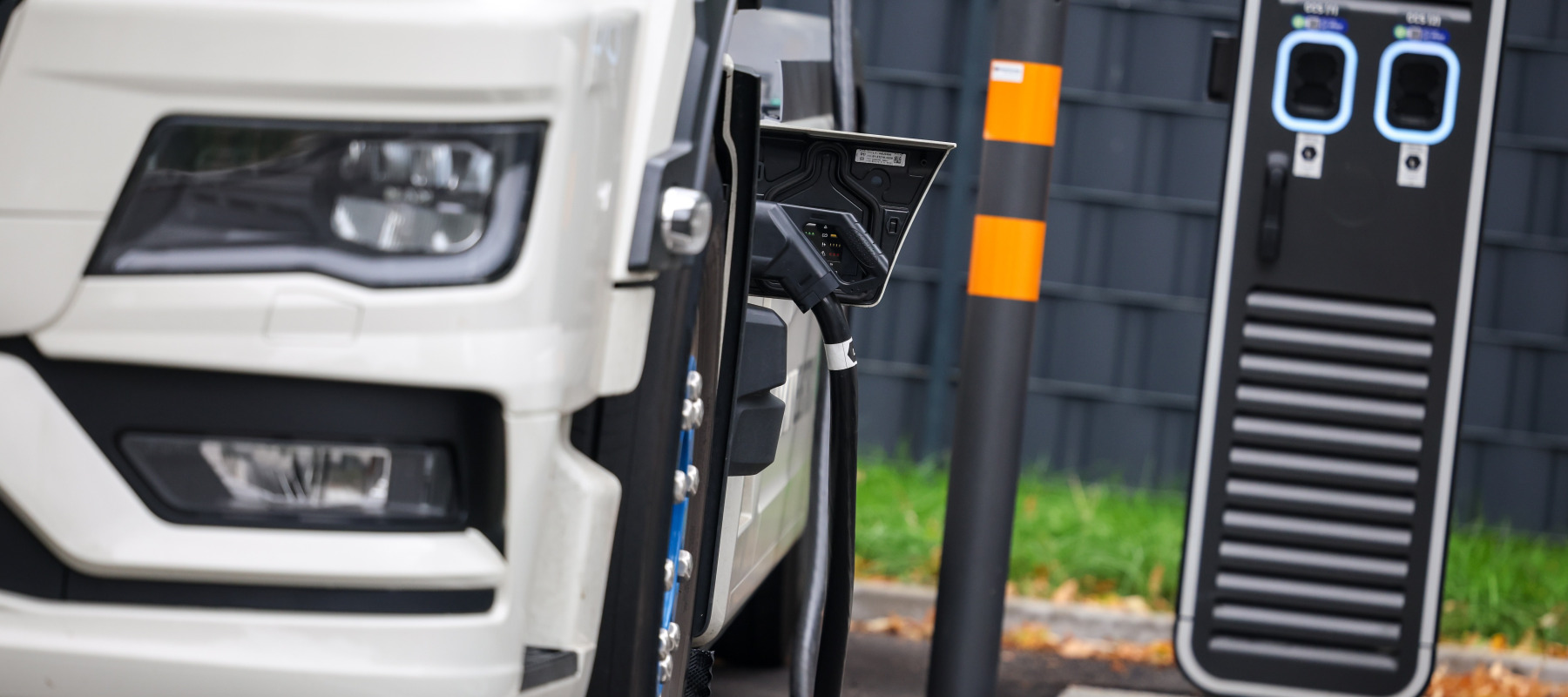 An electric truck is being charged at a Hypercharger, a charging station for electric vehicles.