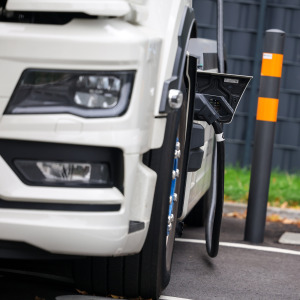 An electric truck is being charged at a Hypercharger, a charging station for electric vehicles.