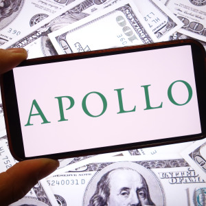 An Apollo Global Management company logo is seen displayed on a smartphone screen