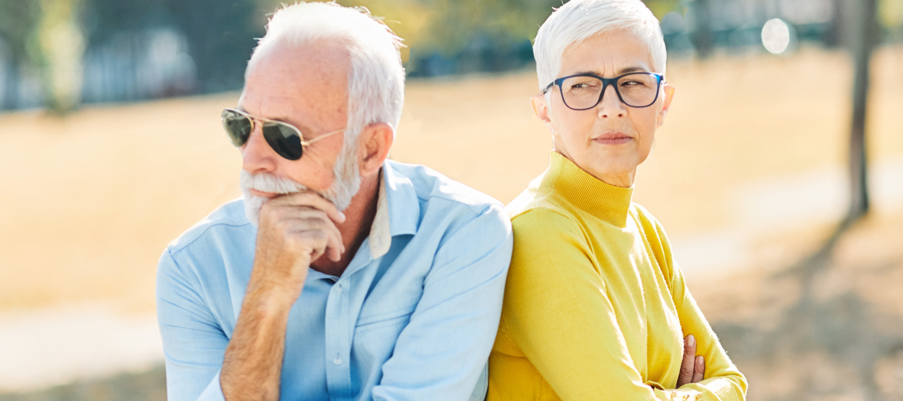 Couple having a disagreement in a park.