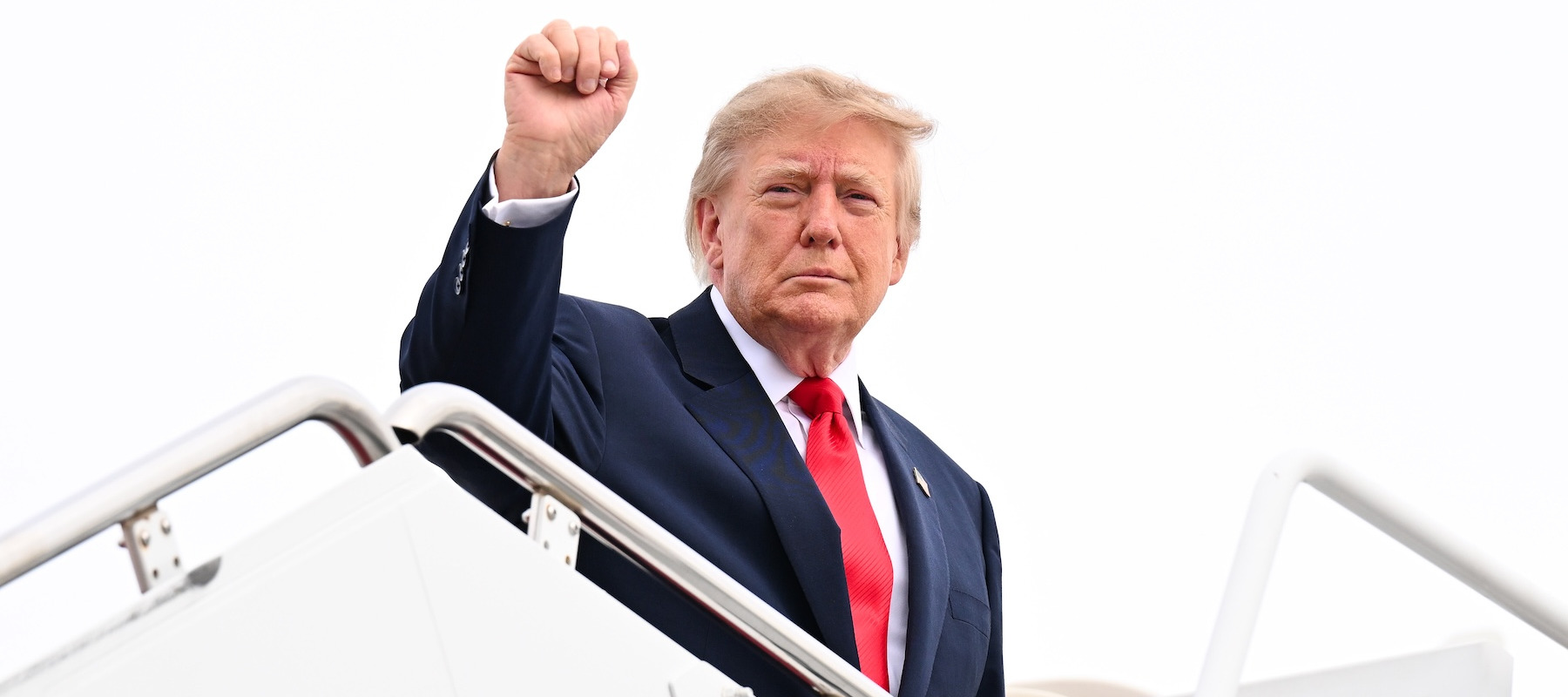President Donald Trump boarding a plane.