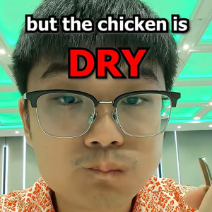 Wen Kang tries the food at the E&amp;O shareholder's AGM.