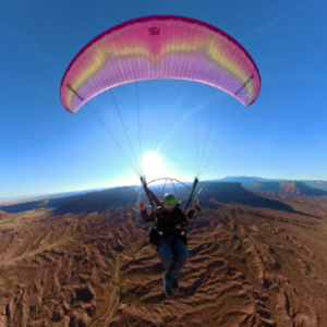Jacob Hutzler flying his paraglider.