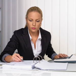 A woman works at her desk.