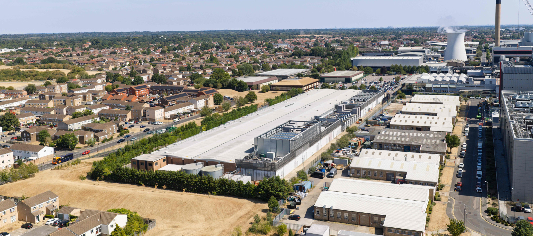 Sprawling industrial data center complex situated next to suburban housing