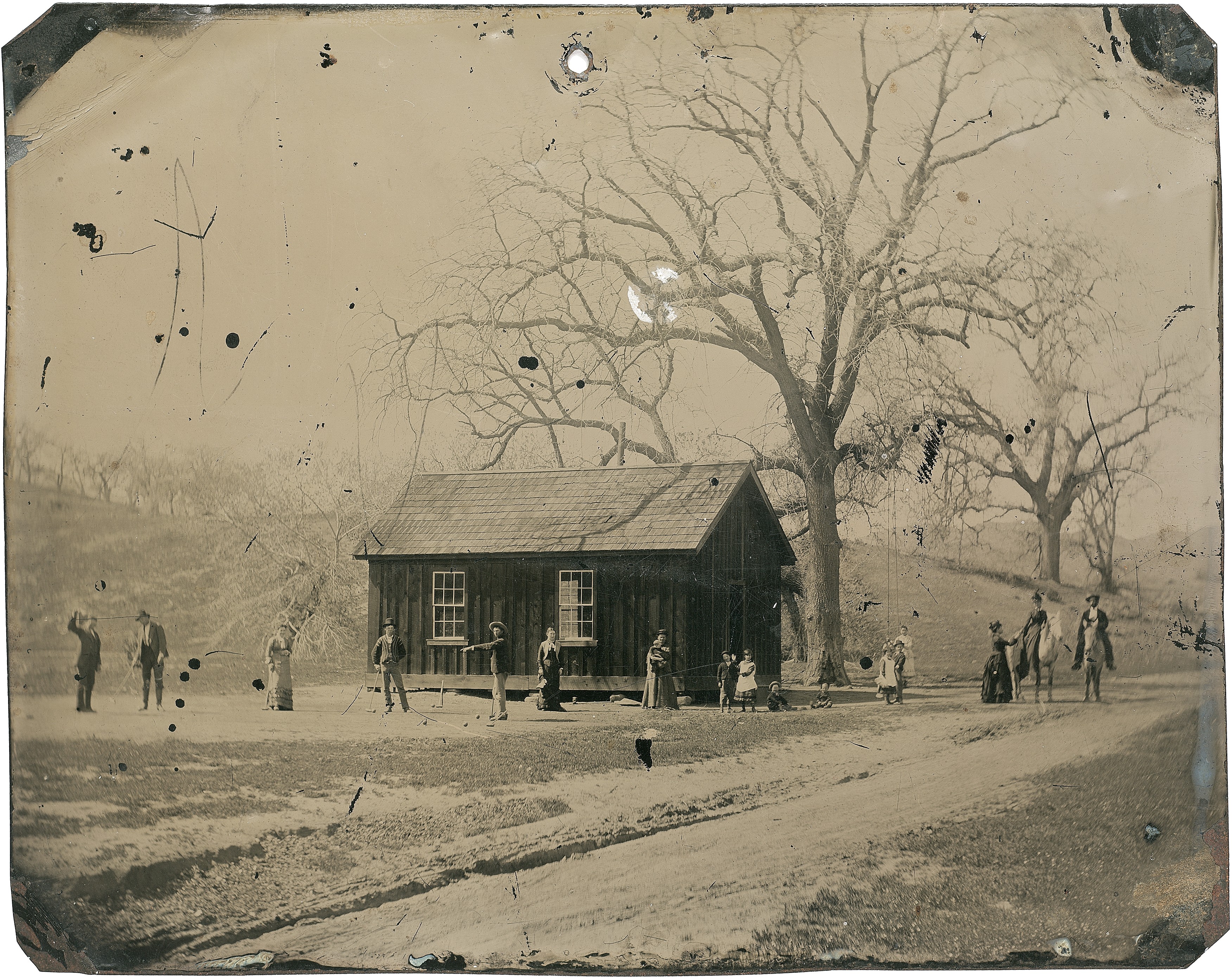 Billy the Kid (left), detail from a 4x5 photograph depicting him and a friend playing croquet in New Mexico, circa 1878.