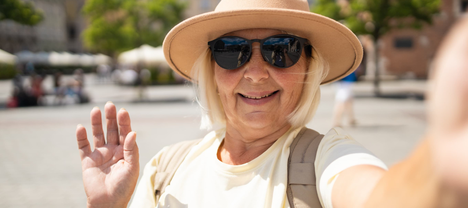 A photo of a woman taking a selfie while traveling