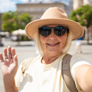 A photo of a woman taking a selfie while traveling