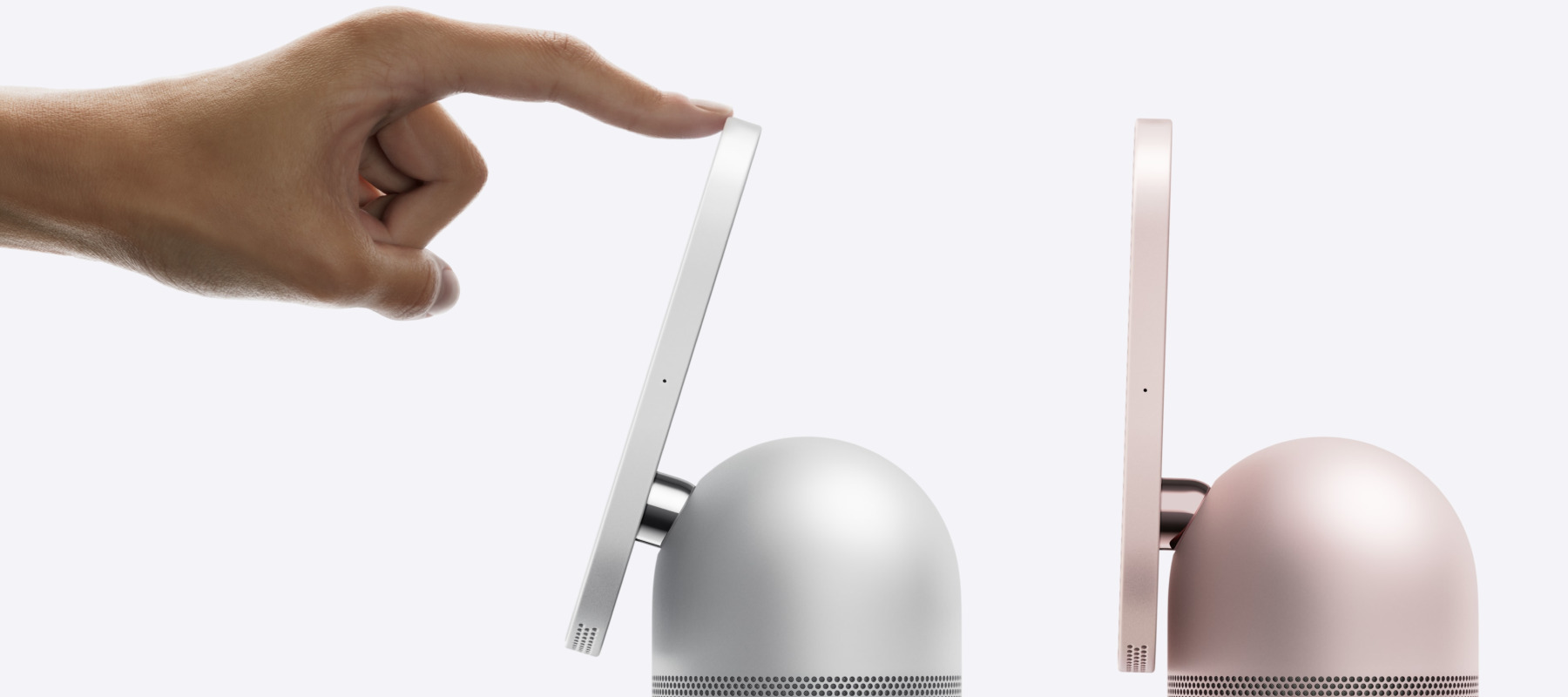 Two apple HomeViews pictured with a hand touching one of the screens.