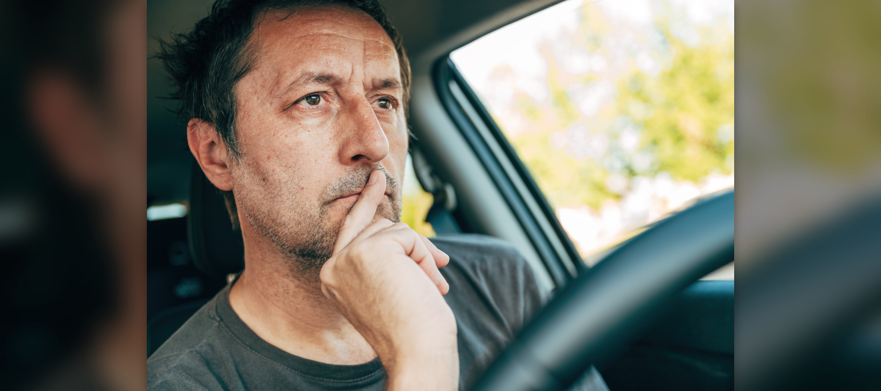 man in car