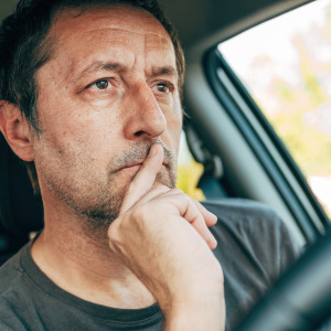 man in car