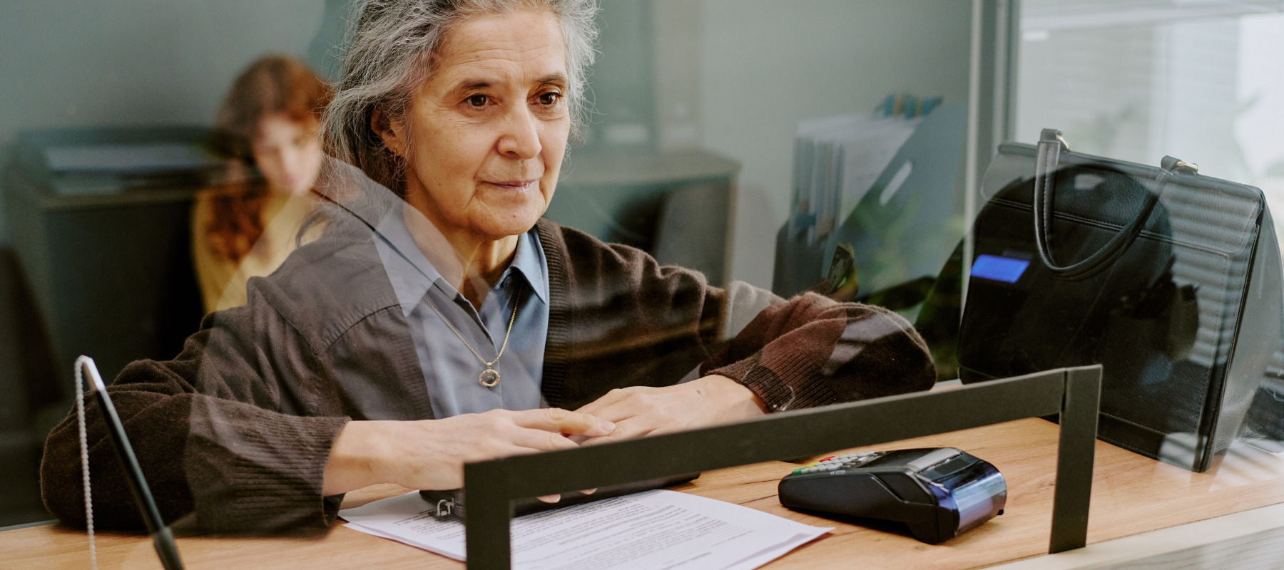 Older woman at bank counter