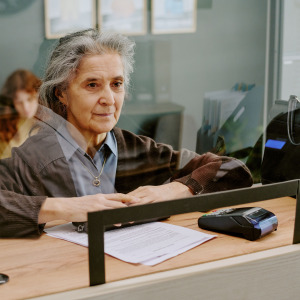 Older woman at bank counter