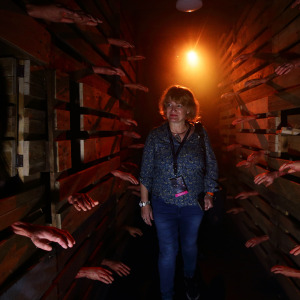 A visitor walks through The Chalet Hauntings haunted house at Universal Studios.