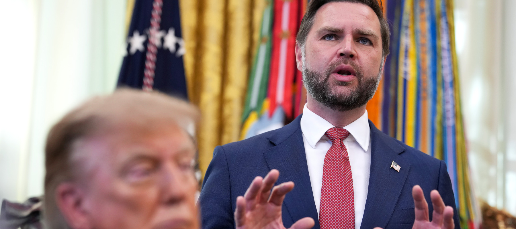 U.S. Vice President JD Vance speaks (R) during an event with U.S. President Donald Trump in the Oval Office of the White House on October 20.