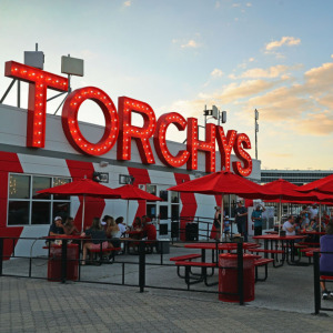 Photo of Torchy’s Tacos and the cow tooth allegedly found in a taco there