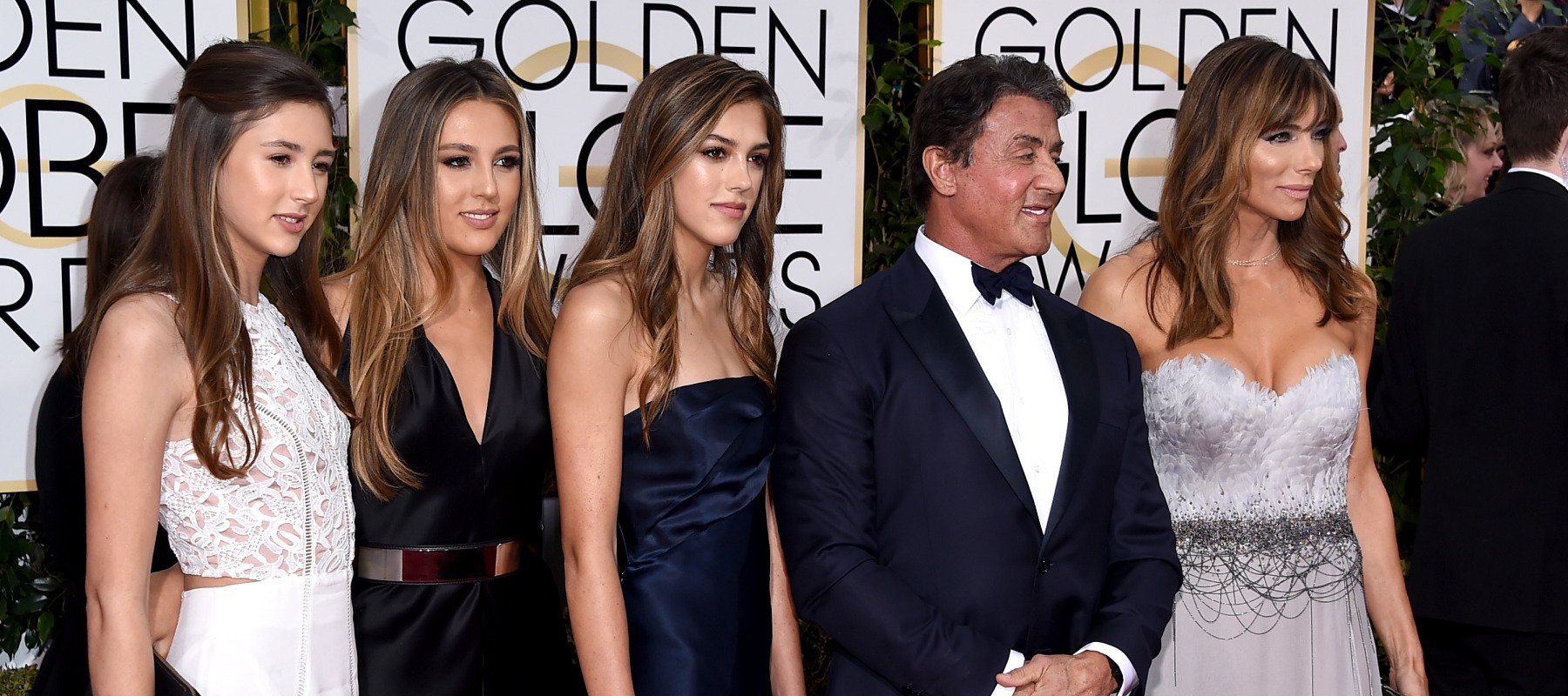 Sylvester Stallone poses for a photo with daughters Sistene, Sophia and Scarlett, and wife Jennifer Flavin.