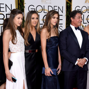 Sylvester Stallone poses for a photo with daughters Sistene, Sophia and Scarlett, and wife Jennifer Flavin.